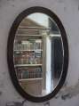 A bookcase in the Mirror