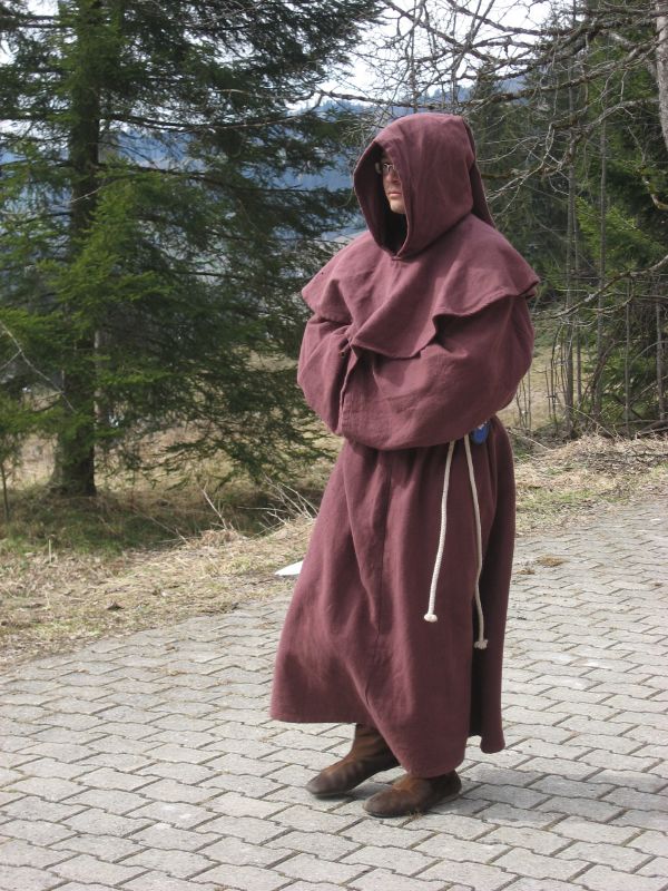 A priest from the village arrives...