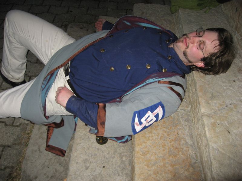 Victor lies wounded on the stairs