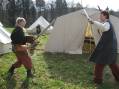 Two cripples practicing sword fighting